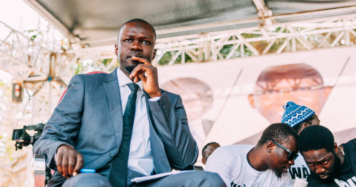 Senegalese presidential candidate, Ousmane Sonko, looks on during a campaign debate with citizens organised by the "Y'en a marre" ("Fed Up") movement at the Douta Seck house of culture in the capital Dakar, on February 21, 2019, a few days ahead of the presidential elections. (Photo by Carmen Abd Ali / AFP)