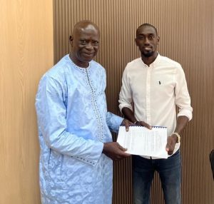 Banjul Sports Commitee President Njie (left) at the signing ceremony