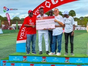 Real De Banjul President Willy Abraham receives cheque